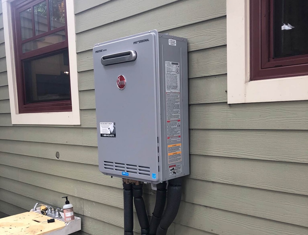 a tankless gas water heater installed outside