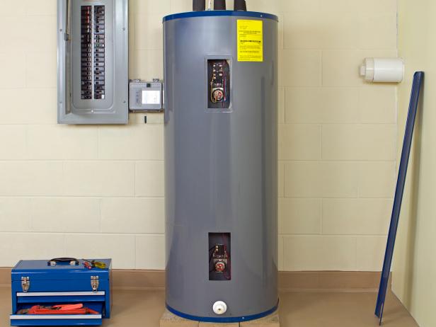 A tank water heater installed in the basement