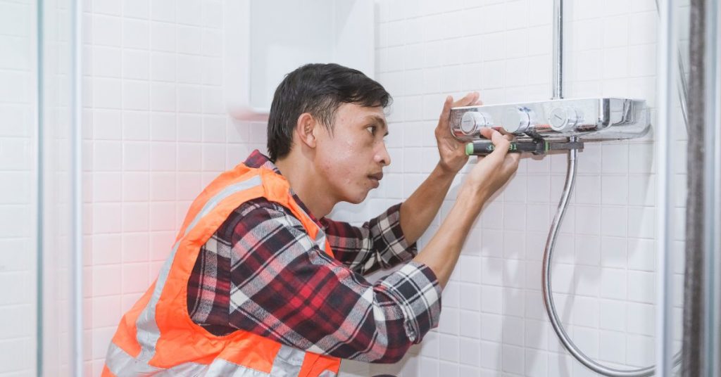 plumber installing water heater